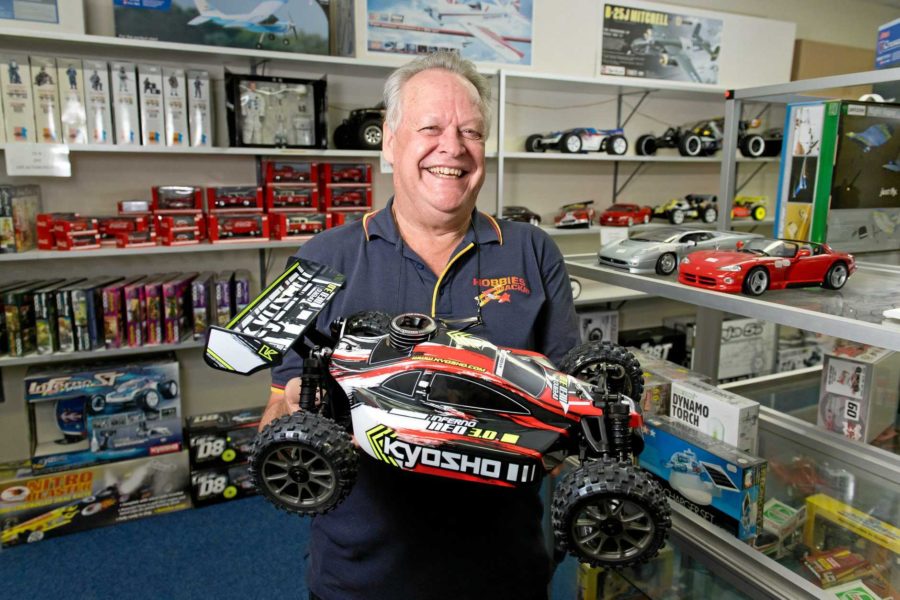 hobby model shop adult man with rc buggy car