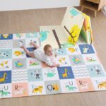 baby playing on a play mat