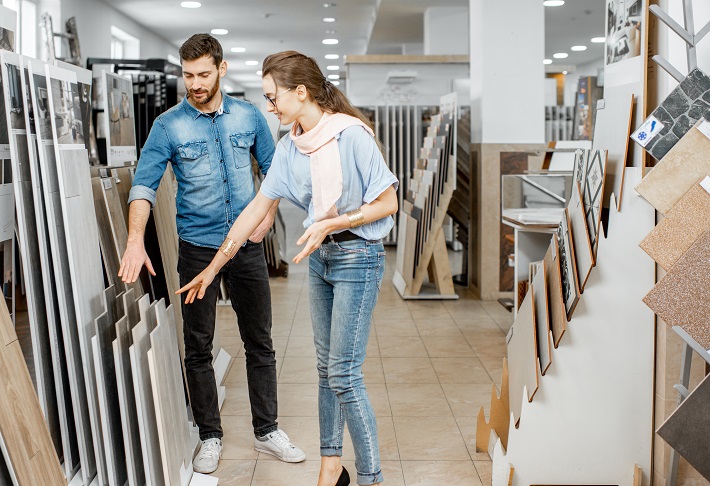 couple choosing tiles in the store