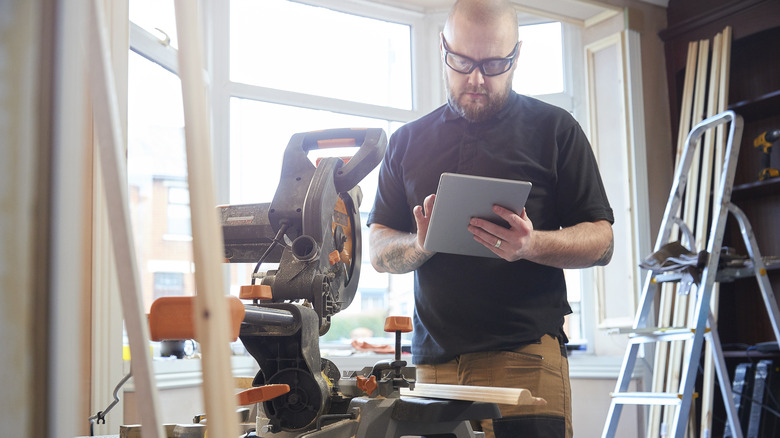 Carpenter preparing to work with his power tools